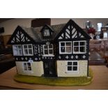 A vintage hand-made dolls house, restored in 1972, to/w a collection of furniture