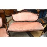 French carved mahogany three piece salon suite comprising a settee and a pair of armchairs,  pink