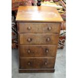 A small victorian mahogany chest of 4 narrow drawers with turned pulls, raised on a plinth base