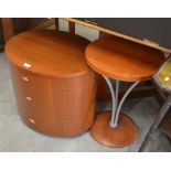 A modern teak oval bedside cabinet with three drawers to/w a matching circular lamp table (2)