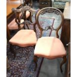 A set of six Victorian carved rosewood dining chairs to/w a pair of balloon back side chairs with
