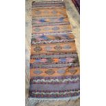 An old kelim runner with bands of repeating designs 175 x 60 cm