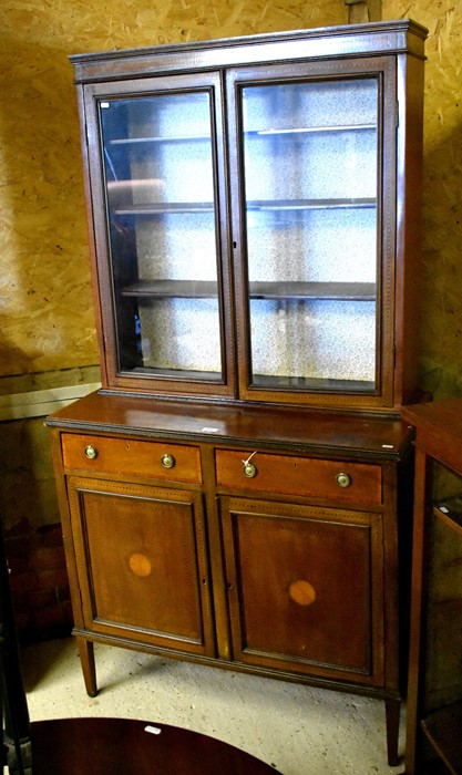 Edwardian inlaid mahogany library bookcase with glazed doors enclosing shelves over two drawers