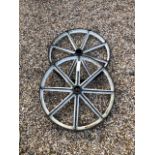 Two antique cast iron railway wheels, probably a luggage cart (differing sizes) (2)