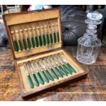 Cased part set of dessert knives + forks, dyed green handles, to/w a cut glass decanter (2)