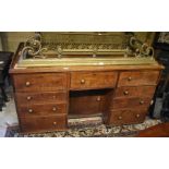 Large 19th century mahogany knee hole desk with nine drawers around a recessed central cupboard with