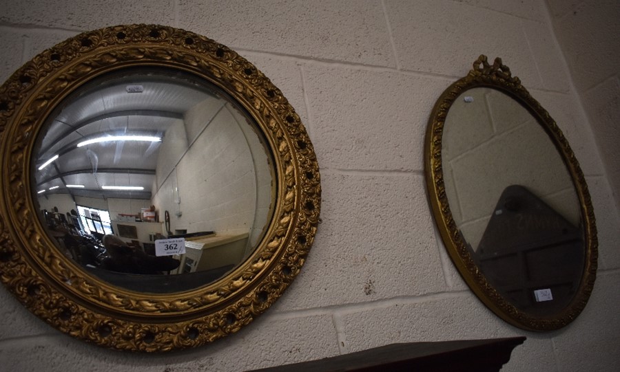 A decorative gilt framed convex wall mirror and another gilt framed mirror (2)
