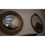 A decorative gilt framed convex wall mirror and another gilt framed mirror (2)