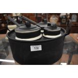 A Wedgwood black metal four-ceramic saucepan bain marie