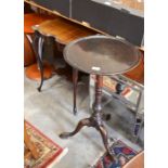 A 19th century mahogany tilt-top table on turned column and triform supports to/w a mahogany