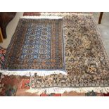 Indo-Persian part silk Kashan style rug to/w a Bokhara blue ground rug with repeating gul design (