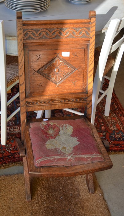 Carved oak folding chair with tapestry seat