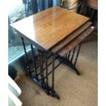 Nest of three mahogany occasional tables raised on slender turned supports
