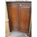 A mahogany corner cupboard