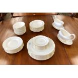 A Wedgwood white monochrome and gold rim dinner service (Signet Gold Pattern) including: two large