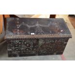 A small stained hardwood and brass studded Zanzibar chest, the interior with fitted candle box