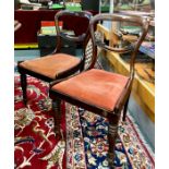 A set of six Victorian rosewood dining side chairs with fabric seat pads, raised on turned front