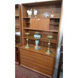 G Plan style teak bookcase with sliding doors and open shelves over five drawers