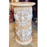 A late Victorian pottery stand moulded with mythical animals