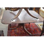 A 19th century mahogany breakfast table with rectangular tilt-top raised on a turned column and