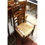 A provincial oak ladderback and rush seated chair, mahogany carver chair, inlaid side chair and oval