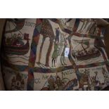 A Bayeaux tapestry heat resistant tablecloth, two patterned tablecloths and a set of twelve matching