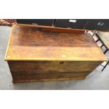 A large waxed pine blanket chest with cleated hinged top and fitted candle box