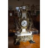An Italian gilt spelter ornate twin-train mantel clock, the dial flanked by classical figures