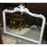 A large bevelled overmantle mirror in acanthus carved cream painted frame