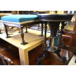 A square oak framed footstool with turquoise upholstery to/w an ebonised and gilt decorated sewing