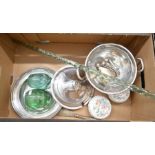 A box containing electroplated ware including a lidded tureen, spoons, cigarette case and egg cup,