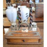 An Edwardian oak desk stand c/w two ink bottles and one small drawer and a pair of oak barley