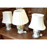 A pair of Portmeirion Aqulegia table lamps and a matching larger Honeysuckle table lamp all with