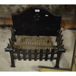 A cast iron fire grate and fireback 44.50cm high x 46.5cm wide x 30cm deep (+7cm protrusion)