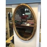 A Victorian oval gilt framed wall mirror to/w a square gilt framed mirror (2)