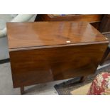 A 19th century mahogany drop leaf dining table