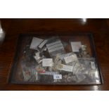 A table top vitrine containing a collection of Victorian and other World coinage