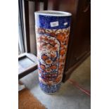 A Japanese Imari stick stand of typical, cylindrical form, decorated with floral designs, Meiji