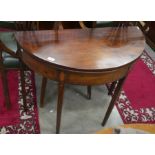 A 19th century inlaid mahogany demi lune tea table with folding top and tapering square supports