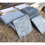 A mixed quantity of surplus slate/stone/porcelain flagstones/floor tiles