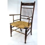 An Arts & Crafts period stained beech framed rope seat armchair, in the manner of Liberty & Co.