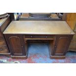 A Victorian mahogany pedestal desk, the top with inset leatherette surface over a centre frieze