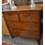 A small 19th century mahogany chest of two short over two long drawers with brass handles, raised on