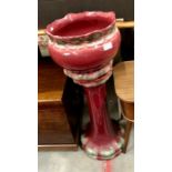 An Art Nouveau style red jardiniere with matching stand (2)