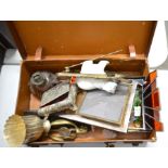 A small vintage suitcase containing mixed items including three photograph frames, Lladro polar