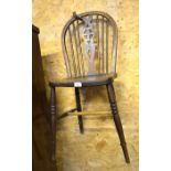 A pair of elm seated wheel back chairs to/w a pair of spindle back chairs (4)