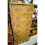 Early 20th century tall boy chest with six drawers, raised on a plinth base