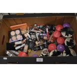 A mixed box to include a collection of scented candles and two bags of new, unused assorted make-