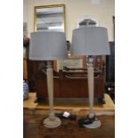 A pair of limed wood table lamps to/w grey shades