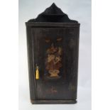 An 18th century Japanned hanging corner cupboard